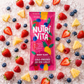 Nutri Vita Berry Blast juice lolly packet on crushed ice with strawberries, raspberries, blueberries and pineapple