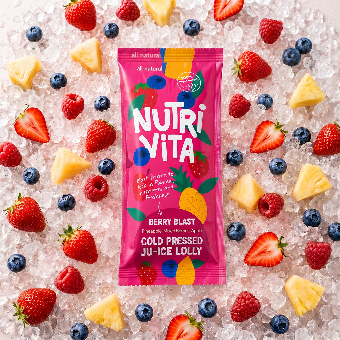 Nutri Vita Berry Blast juice lolly packet on crushed ice with strawberries, raspberries, blueberries and pineapple