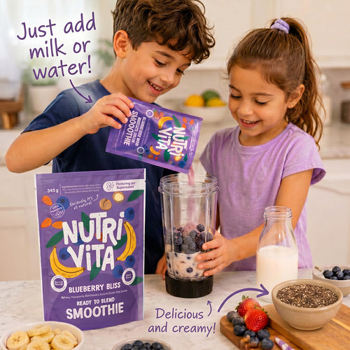 Blueberry Bliss smoothie mix pouch beside children preparing a berry smoothie in a blender