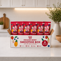 Dragon Berry Smoothie Box with six red Nutri Vita smoothie pouches on a kitchen counter