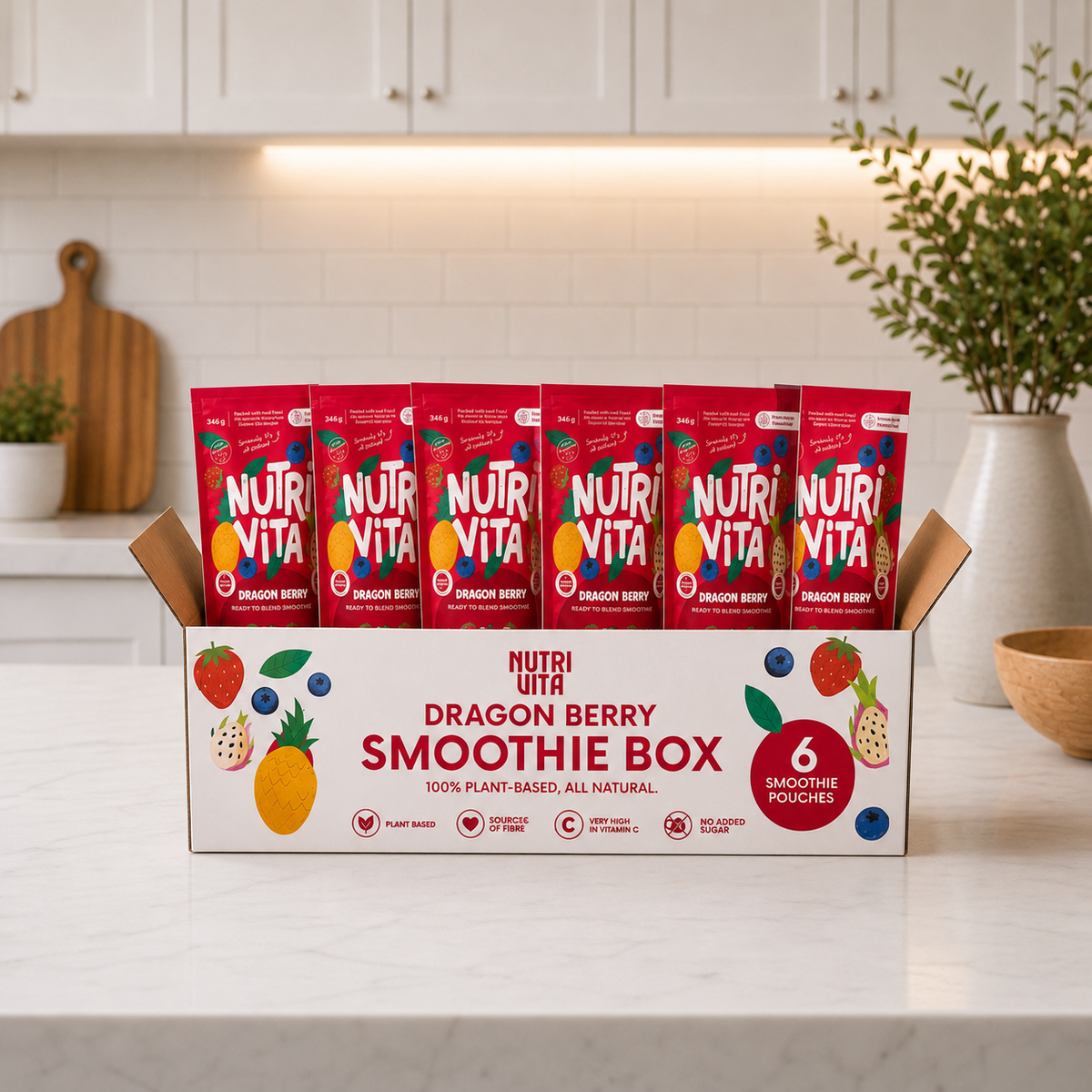 Dragon Berry Smoothie Box with six red Nutri Vita smoothie pouches on a kitchen counter