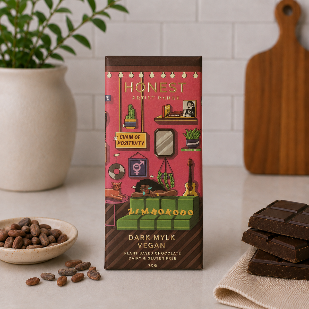 Honest Dark Mylk vegan chocolate bar in illustrated pink packaging beside stacked chocolate pieces