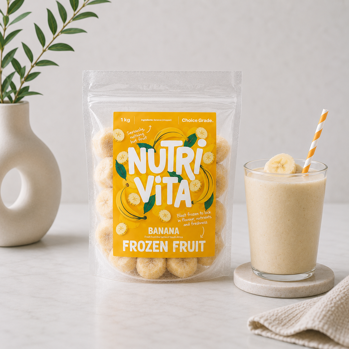 Nutrivita banana frozen fruit pouch beside a banana smoothie topped with banana slices