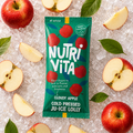 Nutri Vita Cloudy Apple cold pressed juice lolly in a green wrapper on crushed ice with fresh apple slices