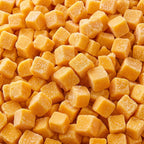 Close-up of orange frozen mango chunks covered with frost