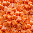 Close-up of orange frozen papaya chunks with visible frost